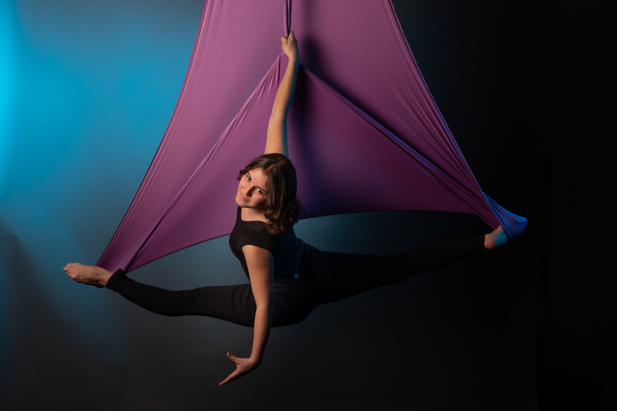 Prestige participant performing on purple aerial silks